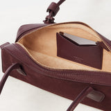 ALAIA LE TECKEL SMALL BI-MATERIAL BAG IN LEATHER
